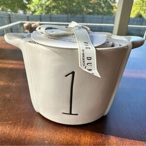 Rae Dunn ceramic measuring cups with numerals on the outside. Set of 4.